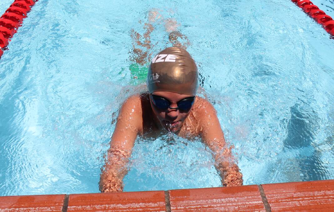 Jase Browne, 10, took the lead in the boys breaststroke finals.