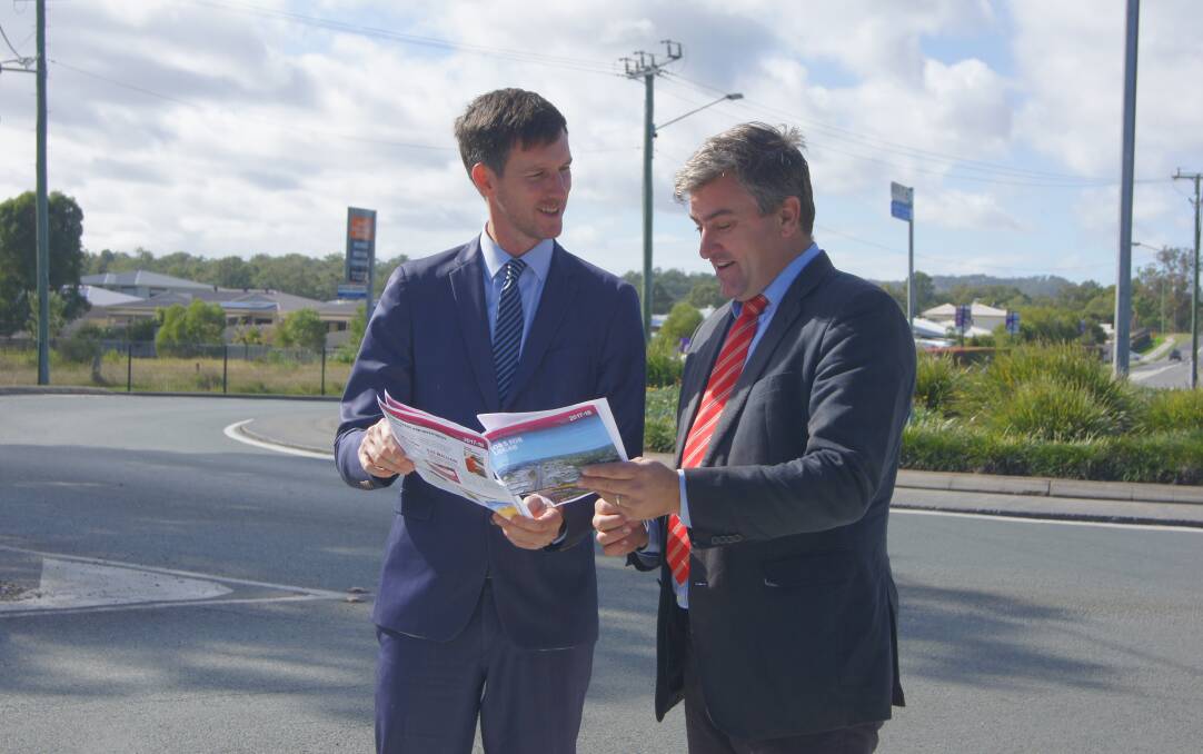 FUNDING: Minister for Main Roads Mark Bailey and Logan MP Linus Power at the Logan Village roundabout. Photo: Georgina Bayly