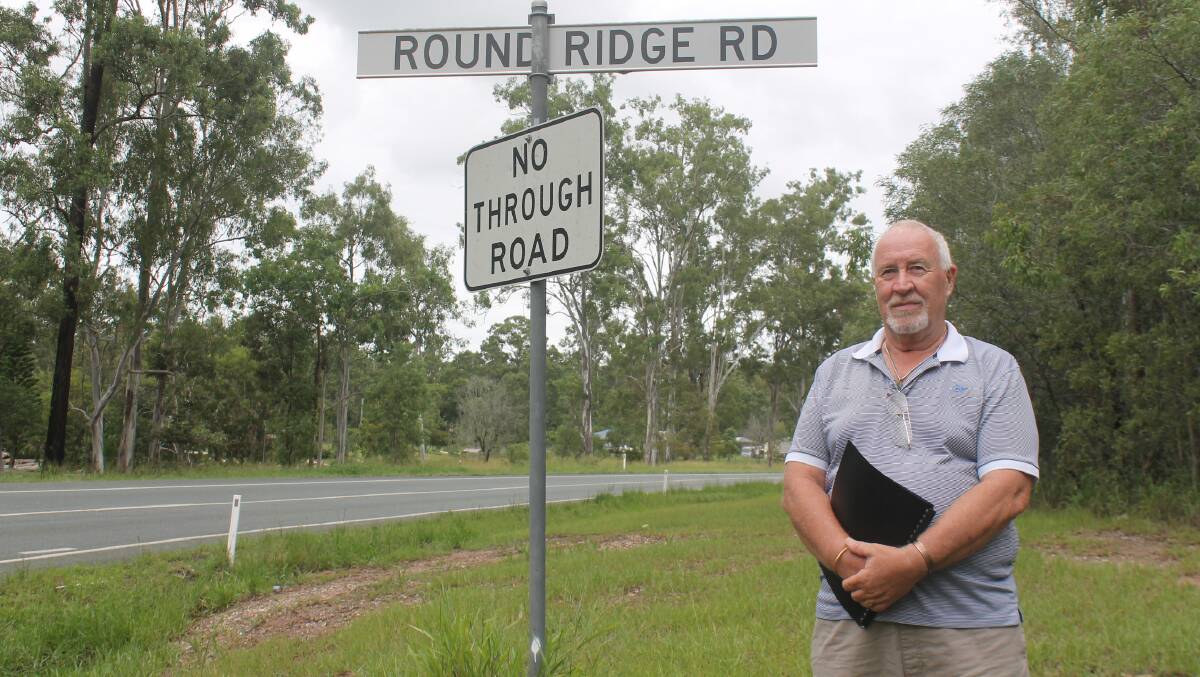 Terry Williams wants to see lighting at the intersection of Round Ridge Road and the Mount Lindesay Highway. Photo: Georgina Bayly